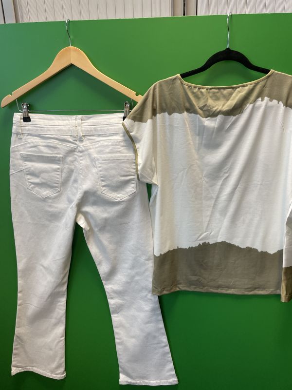 Green top with white jeans