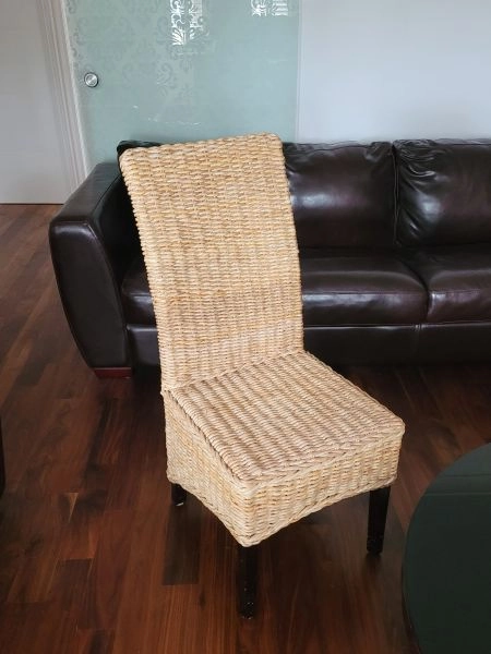 Four natural wicker dining chairs