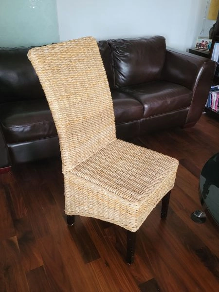 Four natural wicker dining chairs