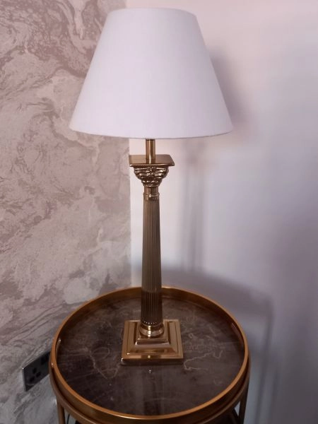 Gold column table lamp.