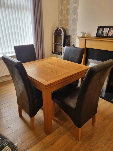 Harvey’s solid wood dinning table, chairs and matching sideboard