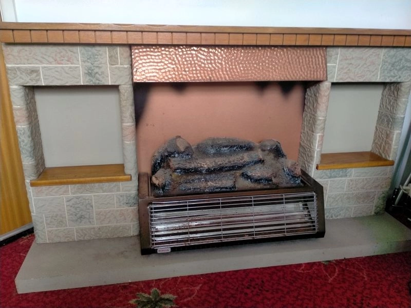 Portable electric fireplace/surround