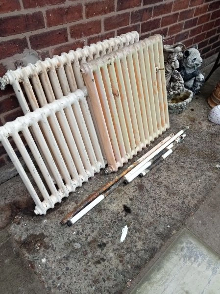 Three old cast iron radiators