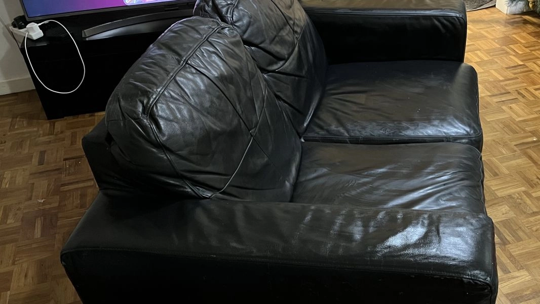 Two seated black leather sofa