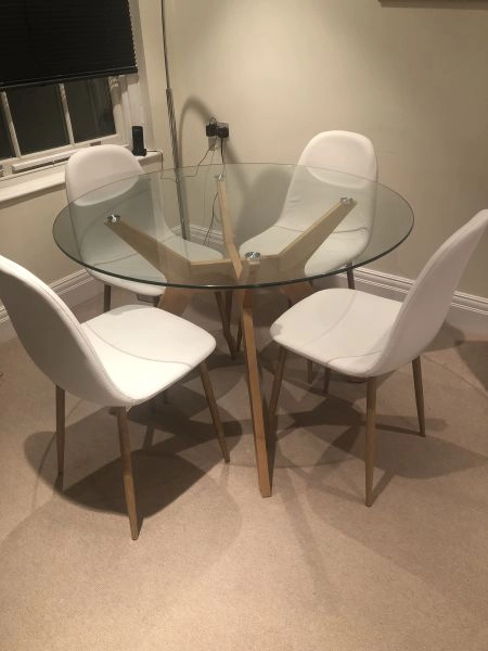 Round glass table with 4 cream chairs