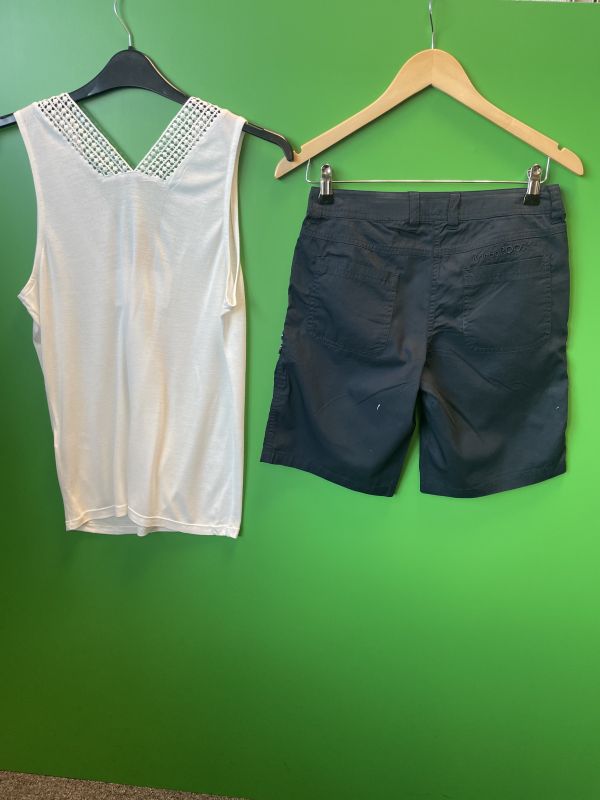 Navy shorts and white vest top